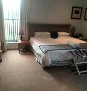 Guestroom with twin beds and private patio