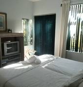 Guestroom with twin beds and private patio