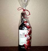 bottle of wine draped with chocolate toffees