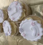 vanilla cupcakes with vanilla buttercream and topper for christening celebration